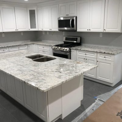 https___cms.countertop.agency_uploads_river_white_granite_kitchen_countertops_and_island_scaled_1_25a2785534